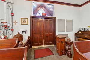 Home office featuring crown molding