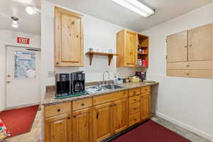 Kitchen with open shelves and a sink