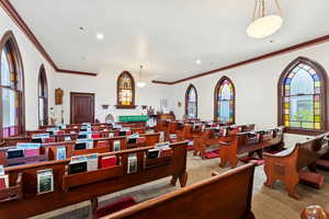 Dining room featuring plenty of natural light, ornamental molding, and recessed lighting