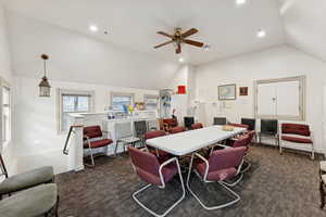 Rec room with recessed lighting, high vaulted ceiling, and a ceiling fan