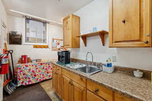 Kitchen with brown cabinets and open shelves