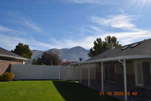 View of yard featuring a mountain view and a patio