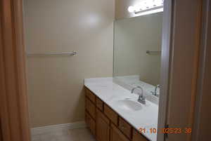 Bathroom featuring vanity and light tile patterned flooring