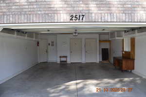 Garage featuring baseboards