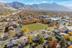 Aerial perspective of suburban area with a mountain backdrop