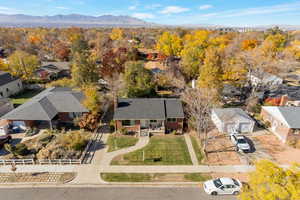 Aerial perspective of suburban area featuring a mountain backdrop