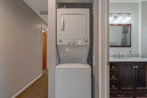 Upstairs Laundry with new stacked washer / drying machine