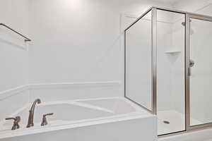 Full bathroom with a bath and a shower stall