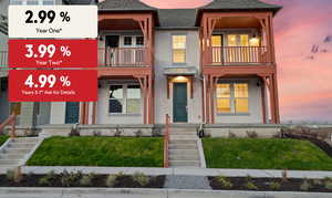 View of front of property with stucco siding, a shingled roof, a front lawn, a balcony, and a porch