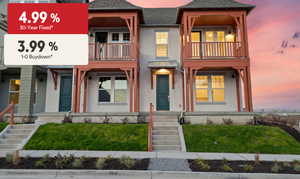 View of front of home with stucco siding, roof with shingles, a front lawn, a balcony, and a porch