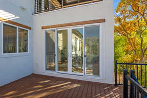Wooden terrace featuring french doors