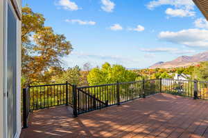 Wooden terrace featuring a mountain view