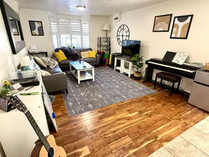 Living room featuring wood finished floors