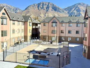 Surrounding community with a courtyard pool and hot tub