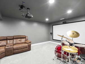 Home theater room featuring carpet and recessed lighting