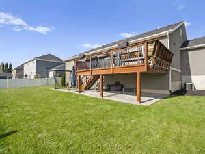 Back of property featuring a patio area, stairs, a deck, and stucco siding