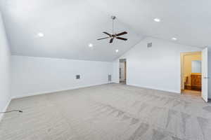 Bonus room with light carpet, lofted ceiling, recessed lighting, and a ceiling fan