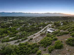 Drone / aerial view of mountains and a tree filled landscape