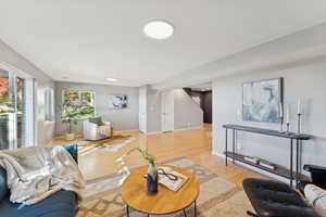 Living room with wood finished floors and baseboards