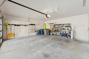 Garage featuring a garage door opener