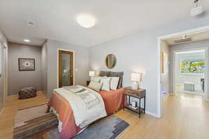 Bedroom with light wood-style floors