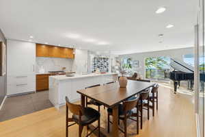 Dining area featuring light wood-type flooring and recessed lighting