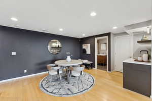 Dining room featuring recessed lighting and light wood-style flooring