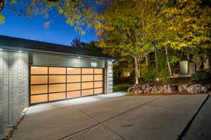 Garage at night with driveway