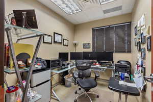 Home office featuring a paneled ceiling