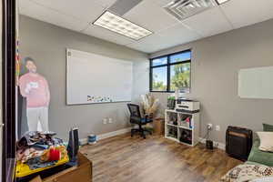 Office featuring a drop ceiling