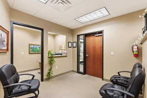 Office space with a paneled ceiling