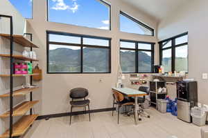Home office with a mountain view and baseboards