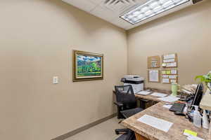 Home office with a drop ceiling