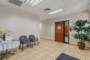Community lobby featuring a paneled ceiling