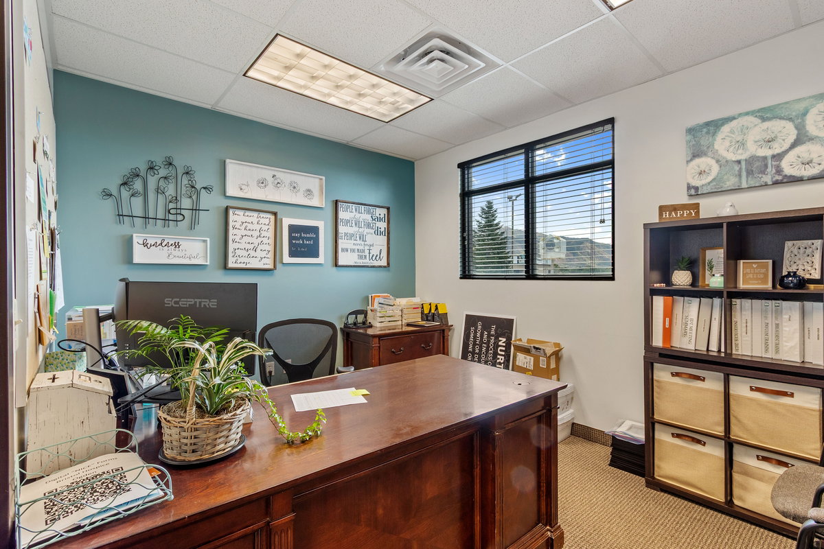 Office featuring a drop ceiling