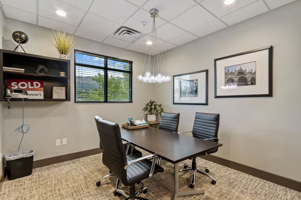 Office with a drop ceiling and recessed lighting