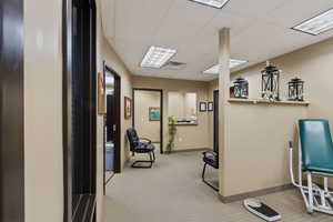 Office area with a paneled ceiling