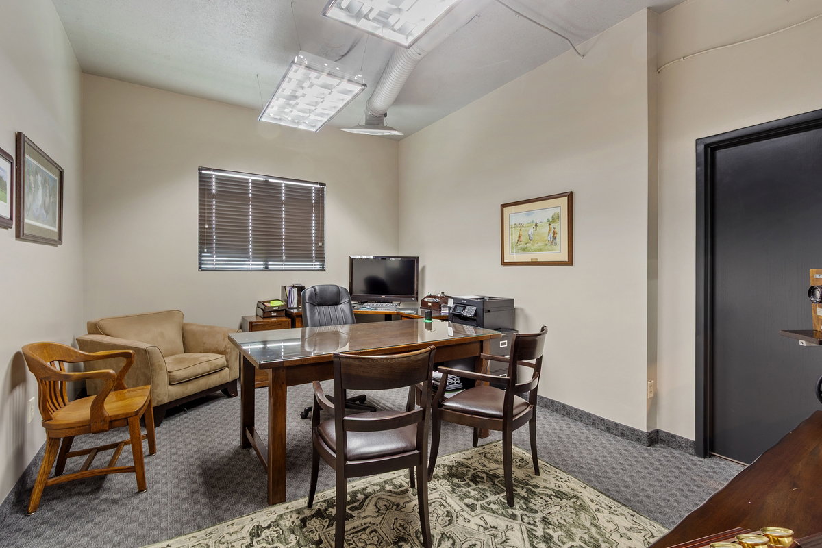 Office area with carpet and baseboards