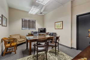 Office area with carpet and baseboards