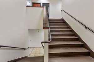 Stairs with tile patterned flooring