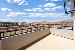 Balcony featuring a residential view and a mountain view