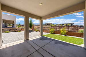Fenced backyard featuring a patio