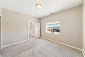 Unfurnished bedroom with carpet floors and a closet