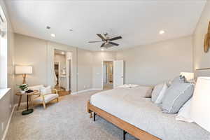 Carpeted bedroom with ensuite bathroom, a ceiling fan, and recessed lighting