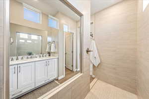 Bathroom with double vanity and walk in shower