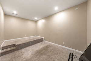 Empty room featuring carpet and recessed lighting