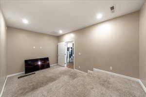 Unfurnished room with carpet and recessed lighting
