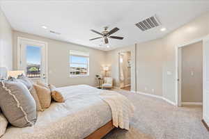 Carpeted bedroom featuring access to exterior, connected bathroom, ceiling fan, and recessed lighting