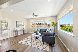 Living area featuring plenty of natural light, light wood finished floors, recessed lighting, and ceiling fan