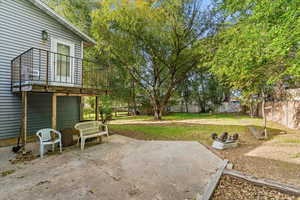 Fenced backyard featuring a patio